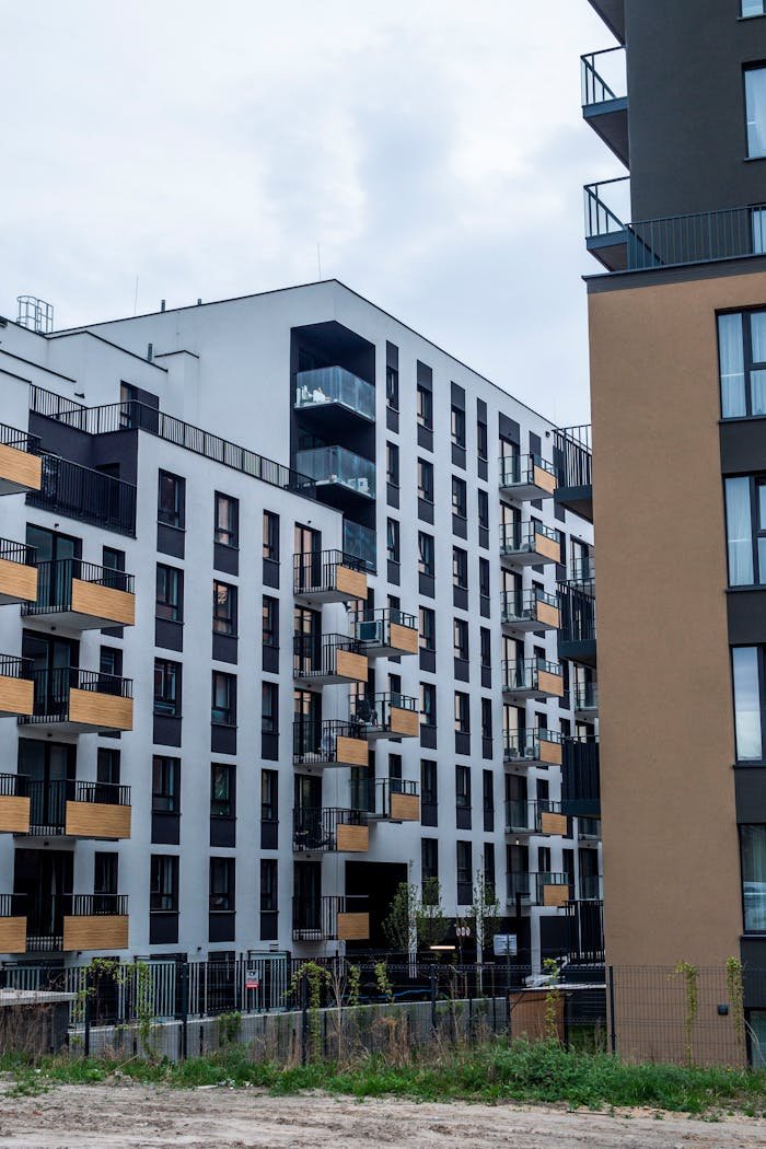 Contemporary apartment blocks showcasing modern architectural design in urban setting.